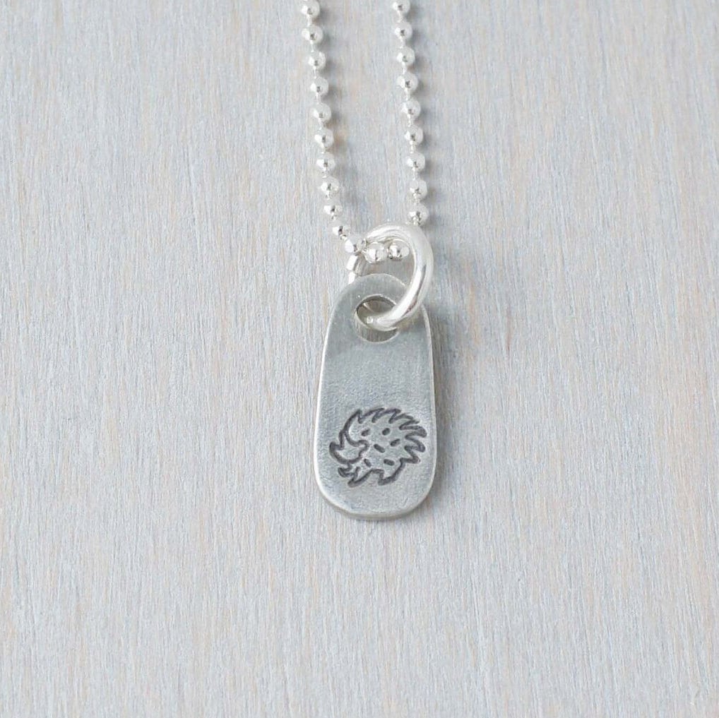 Silver hedgehog necklace in artisan pewter