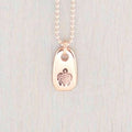 Rose gold necklace stamped with a turtle
