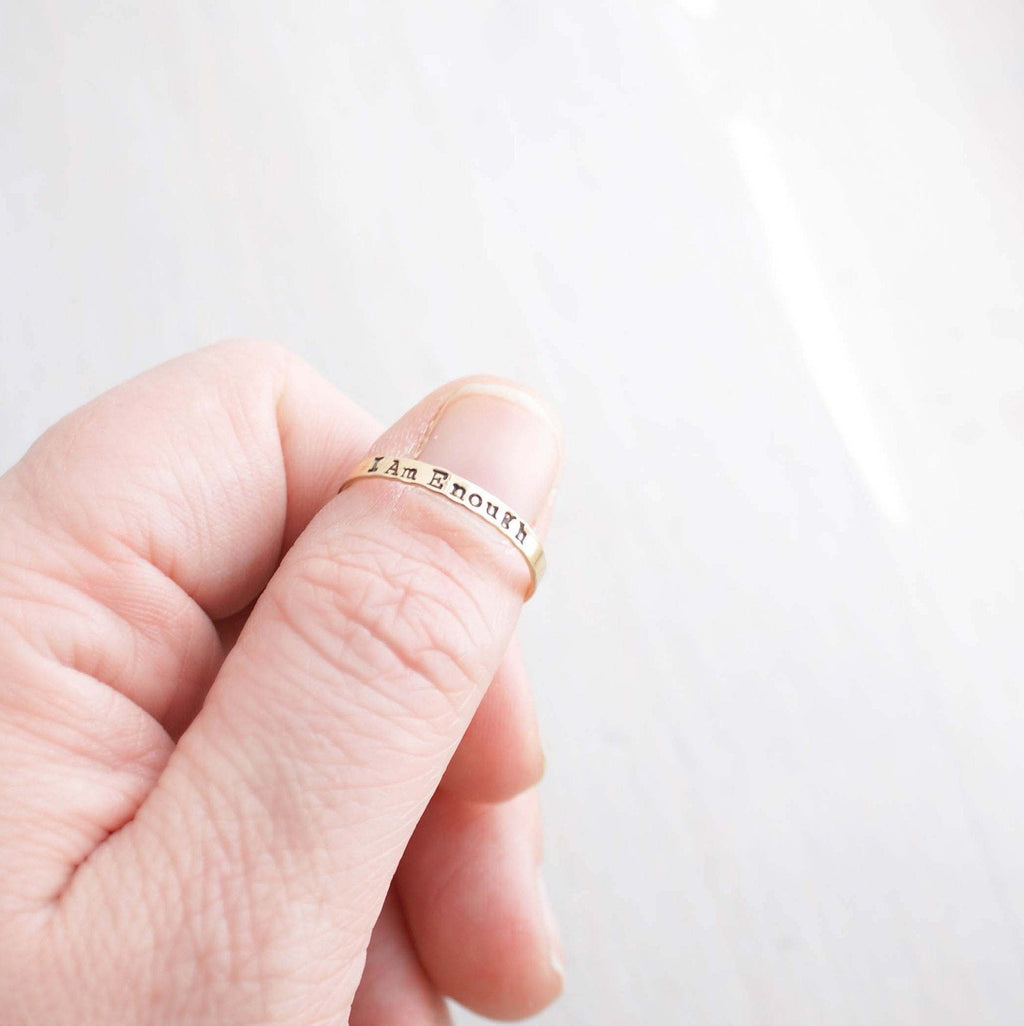 I am Enough ring handstamped in gold-filled on thumb