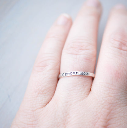 Stacking ring in Sterling silver handstamped with Choose Joy on hand