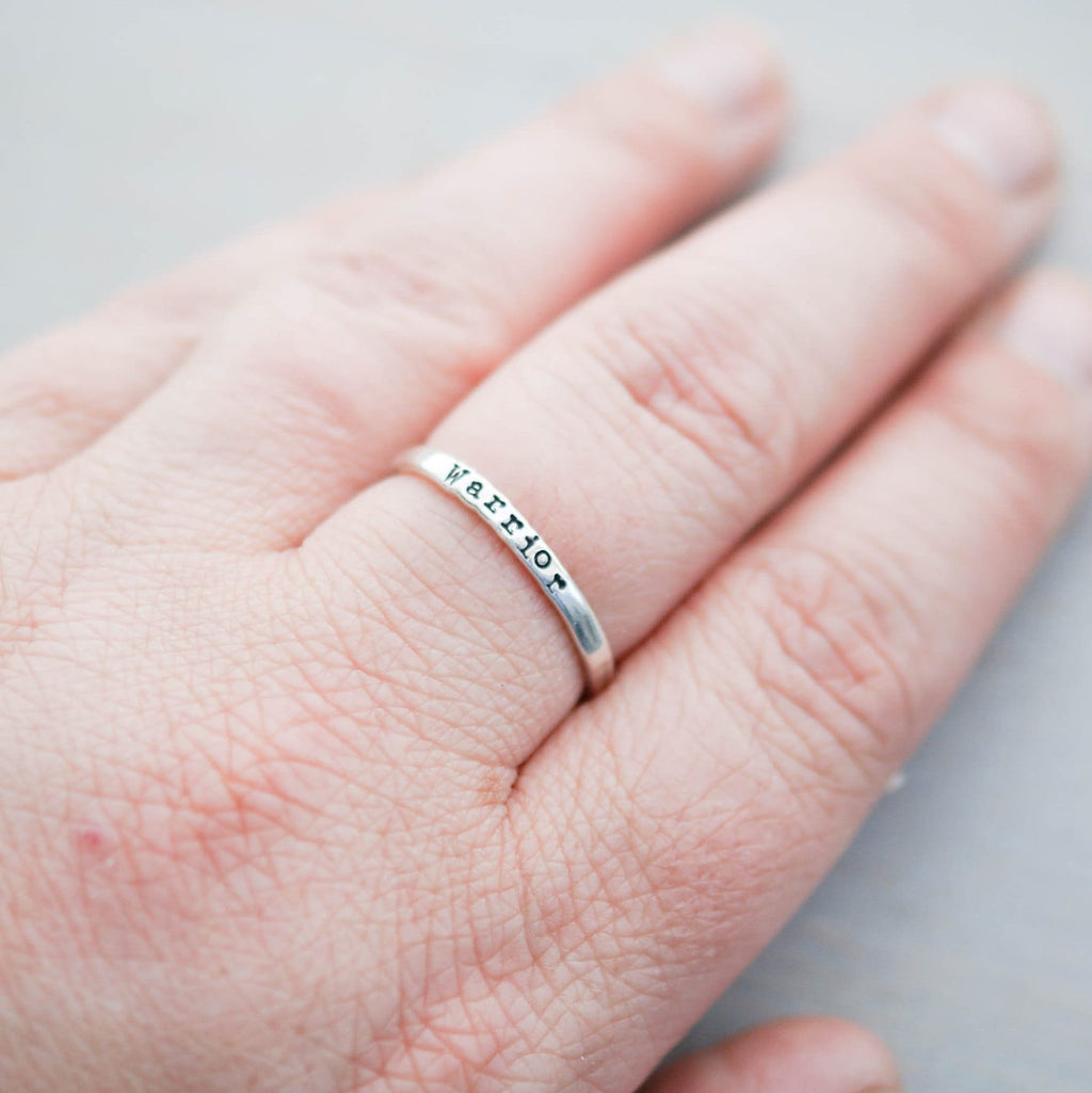 Sterling silver ring stamped with Warrior on hand