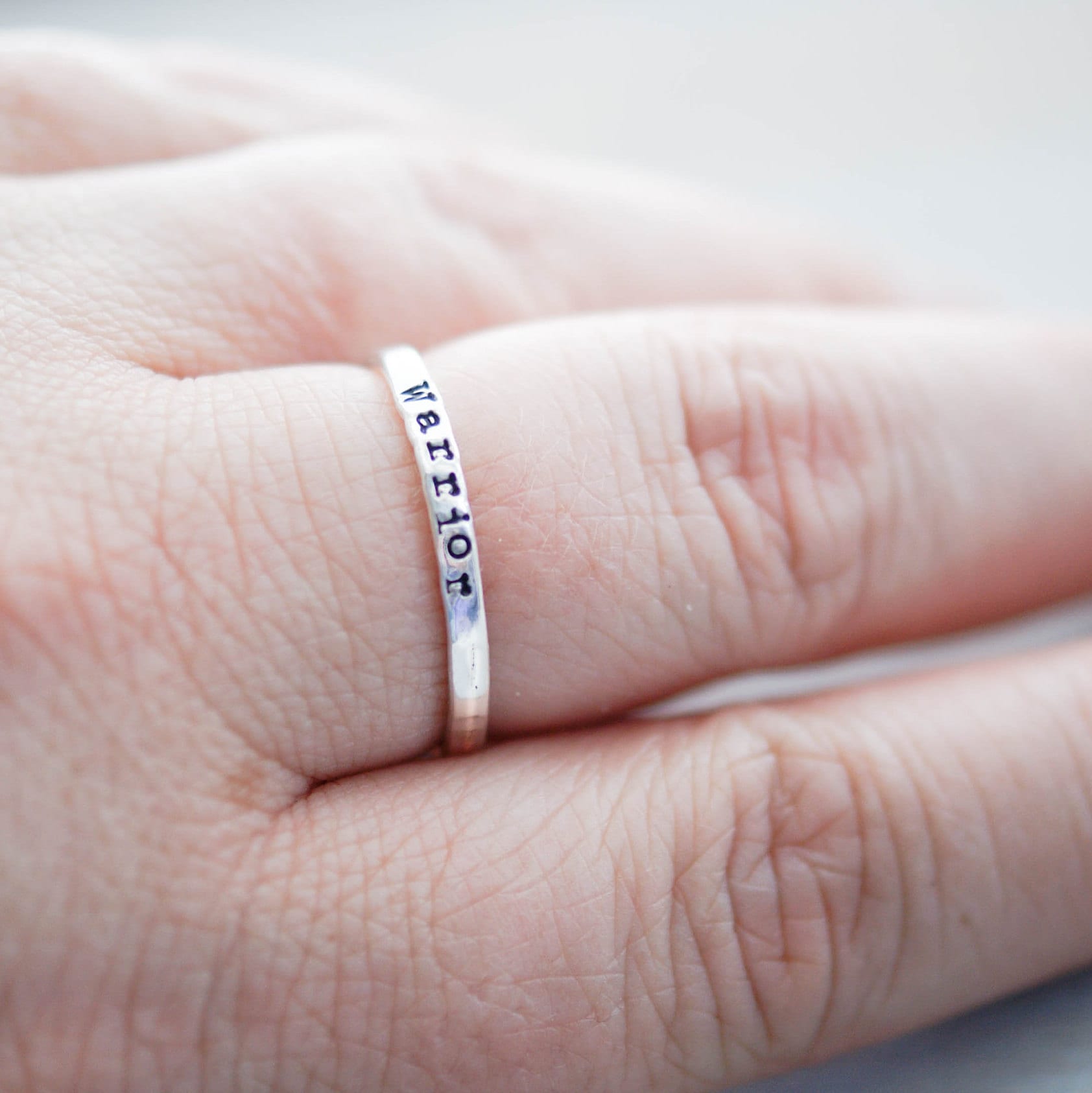 Sterling silver ring stamped with Warrior on hand