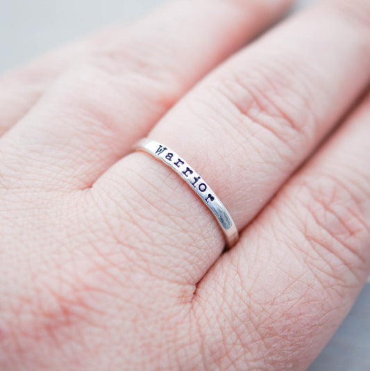Sterling silver ring stamped with Warrior on hand