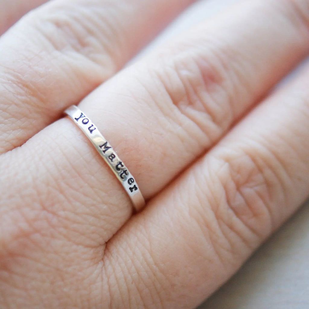 Sterling silver ring stamped with you matter on hand