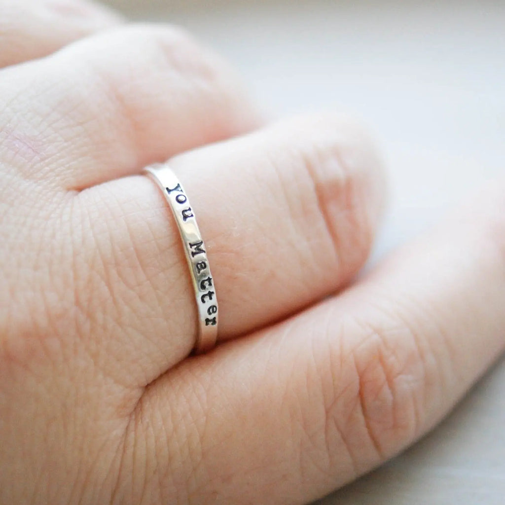 Sterling silver ring stamped with you matter on hand