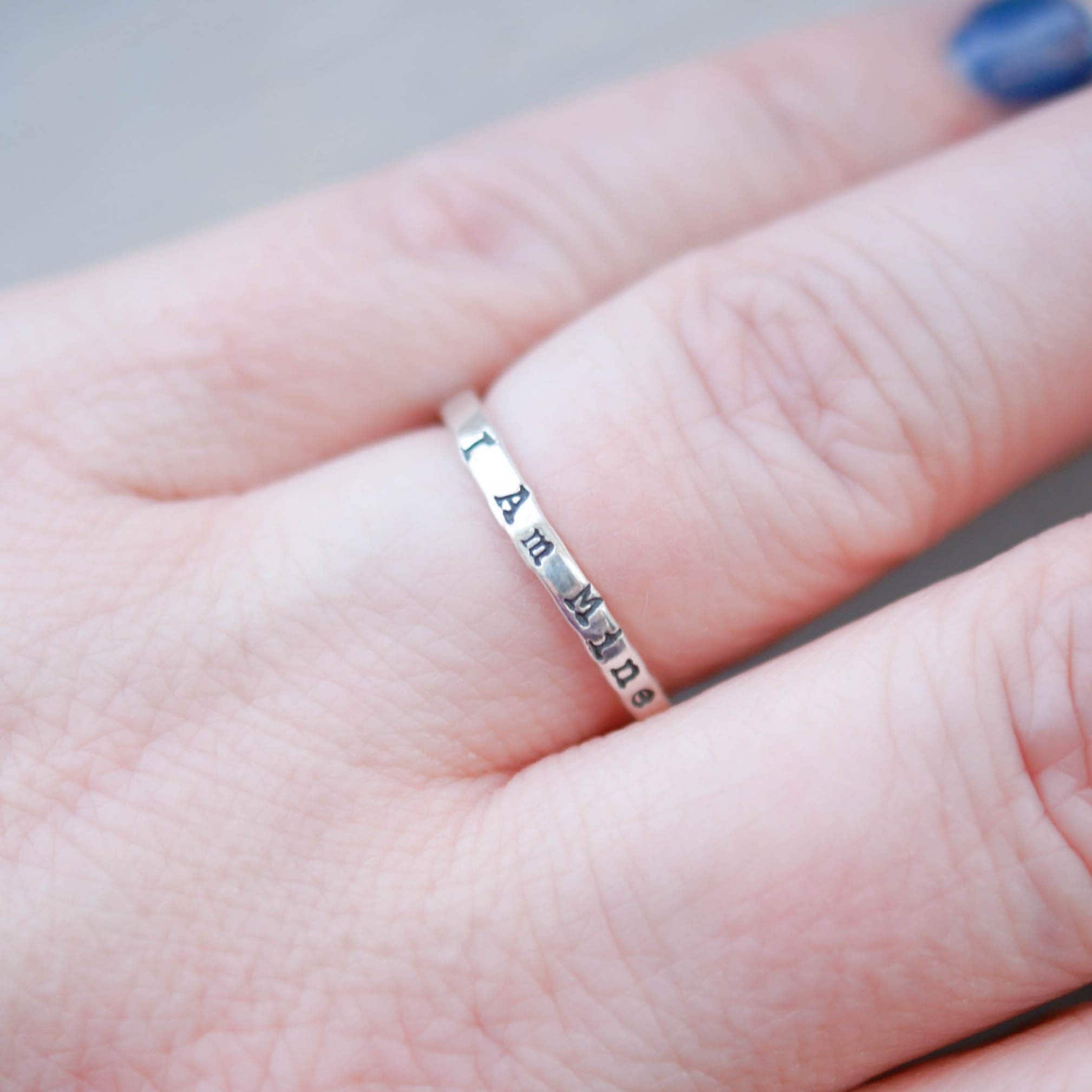 Sterling Silver Stacking Ring handstamped with I Am Mine on hand
