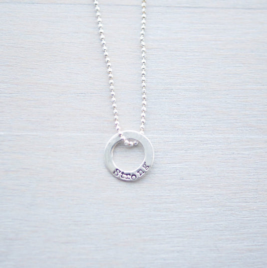 Sterling silver tiny circle stamped with Strong necklace