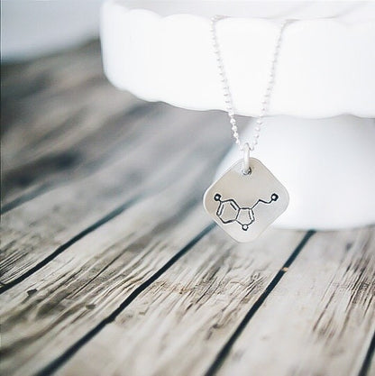 Sterling silver diamond shape necklace stamped with serotonin molecule