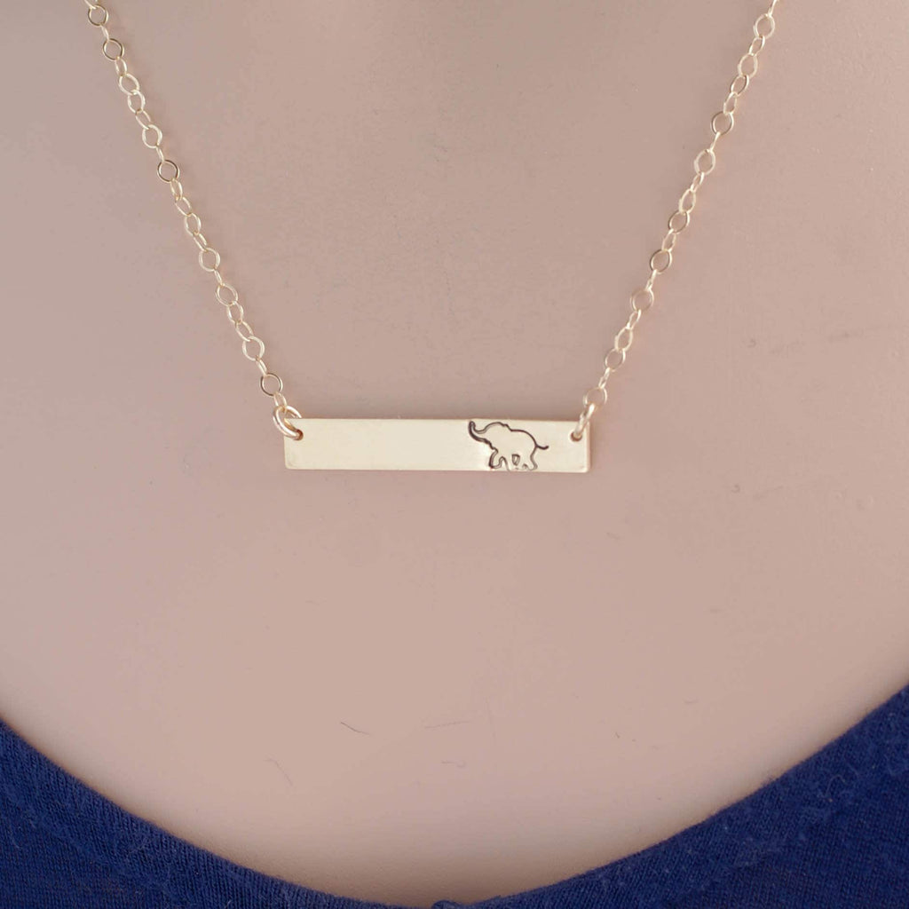 Gold bar neckalce stamped with elephant on necklace
