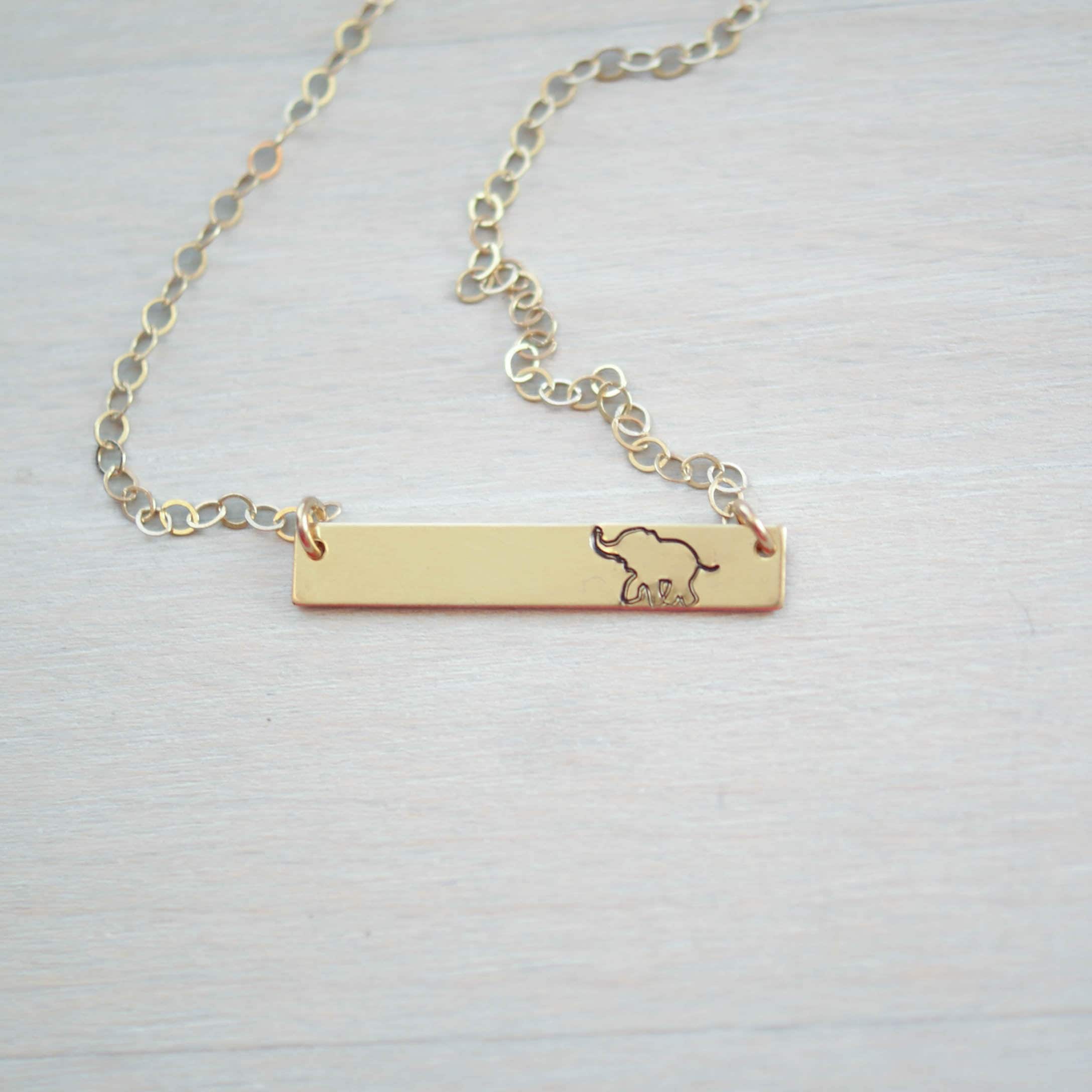 Gold bar neckalce stamped with elephant
