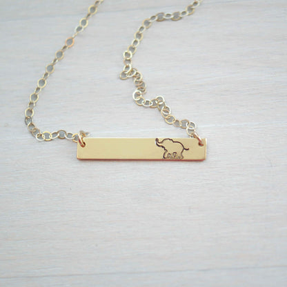 Gold bar neckalce stamped with elephant